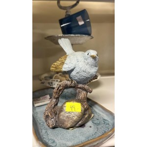 Fugl blå med guld på gren