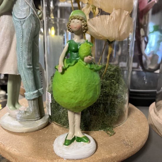 Pige i lime kjole 13 cm lime i venstre hånd